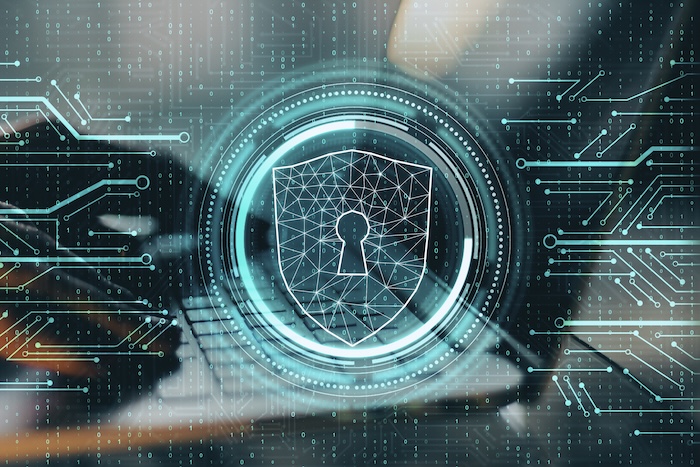 close up of hands using laptop with digital padlock