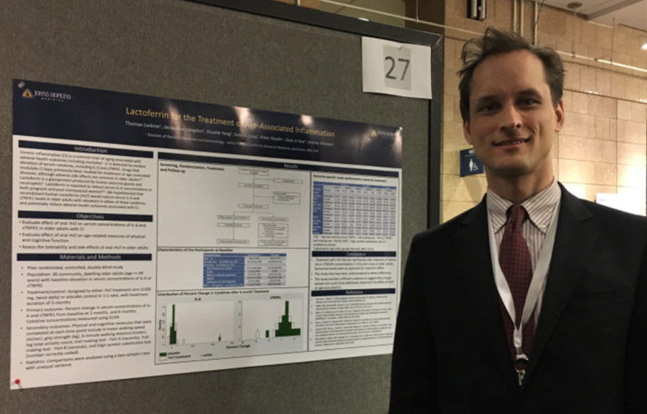 man presenting poster